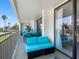 Spacious covered balcony with comfortable seating, perfect for enjoying the ocean breeze at 1430 Gulf Blvd # 102, Clearwater Beach, FL 33767