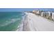 Beautiful beachfront with white sand and buildings lining the horizon at 1460 Gulf Blvd # 406, Clearwater Beach, FL 33767