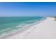 Expansive beach view with crystal clear waters and soft, white sand at 1460 Gulf Blvd # 406, Clearwater Beach, FL 33767