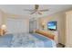 Inviting bedroom with large closet, TV, and decor in calming colors at 1460 Gulf Blvd # 406, Clearwater Beach, FL 33767