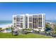 Beautiful beachfront condominium with a pool, parking, lush greenery, and stunning water views at 1460 Gulf Blvd # 406, Clearwater Beach, FL 33767