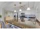 Kitchen with stainless steel appliances, granite countertops, white cabinets, and island seating at 1460 Gulf Blvd # 406, Clearwater Beach, FL 33767