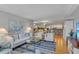 Comfortable living room with blue and white accents and an open layout to the kitchen and dining areas at 1460 Gulf Blvd # 406, Clearwater Beach, FL 33767