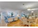 Living room and dining area with wood floors and lots of natural light at 1460 Gulf Blvd # 406, Clearwater Beach, FL 33767