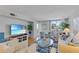 Bright living room with water view, beachy accents, and comfortable seating arrangement at 1460 Gulf Blvd # 406, Clearwater Beach, FL 33767