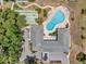 Aerial view of the community, pool area, shuffleboard court and clubhouse, offering resort-style amenities at 1655 S Highland Ave # D140, Clearwater, FL 33756