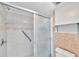 Shower and toilet area with tile backsplash and grab bar at 1655 S Highland Ave # D140, Clearwater, FL 33756