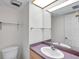 Bright half-bathroom featuring a vanity with sink at 1655 S Highland Ave # D140, Clearwater, FL 33756