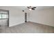 Bedroom with neutral walls, tiled floors and a ceiling fan offering a serene and welcoming space at 1655 S Highland Ave # D140, Clearwater, FL 33756