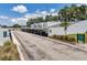 Exterior view of the property with parking spots and sign with address and building numbers at 1655 S Highland Ave # D140, Clearwater, FL 33756