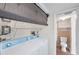 Convenient laundry room adjacent to bathroom with washer and dryer at 1655 S Highland Ave # D140, Clearwater, FL 33756