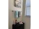 Well-lit bathroom featuring a towel rack with decorative towels and modern fixtures at 16840 Whisper Elm St, Wimauma, FL 33598