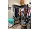 Walk-in closet with ample storage, including shelves, hanging rods, and drawers at 16840 Whisper Elm St, Wimauma, FL 33598