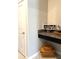 Laundry room counter with sign that reads 'Live Simply' and tiled floors at 16840 Whisper Elm St, Wimauma, FL 33598