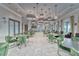 Spacious dining room with modern lighting fixtures and comfortable seating for large gatherings at 16840 Whisper Elm St, Wimauma, FL 33598