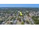 Aerial view of home showing the surrounding neighborhood and nearby lakes at 1710 S Lake Ave, Clearwater, FL 33756
