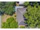 Close aerial view of the roof of a house with yard and trees in the neighborhood at 1710 S Lake Ave, Clearwater, FL 33756
