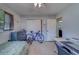 Bedroom boasts a ceiling fan, closet, and a neat desk area, perfect for relaxation or work at 1710 S Lake Ave, Clearwater, FL 33756
