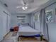 Clean bedroom with a ceiling fan, a window, simple furnishings offering a comforting private space at 1710 S Lake Ave, Clearwater, FL 33756