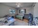 Cozy bedroom featuring a ceiling fan, window and desk ideal for study or work at 1710 S Lake Ave, Clearwater, FL 33756
