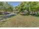 Home with a well maintained lawn and mature trees at 1710 S Lake Ave, Clearwater, FL 33756