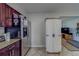 The kitchen features stainless steel appliances, dark cabinetry and leads into the living room at 1710 S Lake Ave, Clearwater, FL 33756
