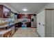 Well-appointed kitchen with dark cabinetry, stainless steel appliances, and tile flooring at 1710 S Lake Ave, Clearwater, FL 33756