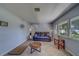 Comfortable living room boasts tile flooring, natural light, and ample space for relaxation and entertaining at 1710 S Lake Ave, Clearwater, FL 33756