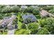 Aerial view of a beautiful home with a pool and lush landscaping in a desirable neighborhood at 19708 Wellington Manor Blvd, Lutz, FL 33549