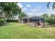 Expansive backyard featuring a screened-in pool and patio area for entertaining at 19708 Wellington Manor Blvd, Lutz, FL 33549