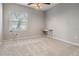 Spacious bedroom offering a minimalist desk and a window providing lots of natural light at 19708 Wellington Manor Blvd, Lutz, FL 33549
