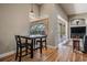 Dining area with outside view to the pool, hardwood floors and easy access to the living room at 19708 Wellington Manor Blvd, Lutz, FL 33549
