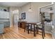 Cozy dining area features hardwood floors, a modern light fixture and a bar height table at 19708 Wellington Manor Blvd, Lutz, FL 33549