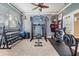 Home exercise room with weights, workout machine, and sports memorabilia at 19708 Wellington Manor Blvd, Lutz, FL 33549