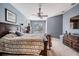 Spacious bedroom with ceiling fan, complemented by natural light streaming through the windows at 19708 Wellington Manor Blvd, Lutz, FL 33549