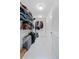 Walk-in closet with white shelving, rod, and tiled floor for optimized storage space at 250 Aberdeen St, Dunedin, FL 34698