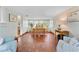 Spacious dining area boasts mosaic tile flooring, and sunlit views at 250 Aberdeen St, Dunedin, FL 34698
