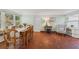 Sunny dining room features mosaic tile flooring and views of the lush landscaping at 250 Aberdeen St, Dunedin, FL 34698