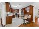 Bright kitchen showcasing dark wood cabinetry, subway tile, white counters, and stainless steel appliances at 250 Aberdeen St, Dunedin, FL 34698