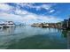 Marina view with boats and yachts docked on calm waters under a sunny sky at 250 Aberdeen St, Dunedin, FL 34698