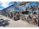 Whimsical mural on exterior wall featuring detailed paintings of dogs, adding character to the building at 250 Aberdeen St, Dunedin, FL 34698
