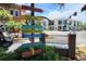 Street sign pointing to waterfront shops, marina, apparel, home decor, jewelry, and restaurants at 250 Aberdeen St, Dunedin, FL 34698