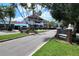 A quaint street view featuring the entrance to Dunedin with lush landscaping and signage at 250 Aberdeen St, Dunedin, FL 34698
