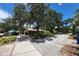 Charming street view with lush landscaping, pedestrian-friendly pathways, and local businesses nearby at 250 Aberdeen St, Dunedin, FL 34698