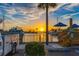 Picturesque waterfront view with yachts and boats at sunset, creating a golden hue at 250 Aberdeen St, Dunedin, FL 34698