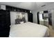 Stylish bedroom featuring a queen bed, a built-in shelves, and a mirrored closet at 2700 Bayshore Blvd # 519, Dunedin, FL 34698