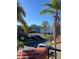 Exterior view showcasing townhomes with garages and well-maintained landscaping in a sunny neighborhood at 2700 Bayshore Blvd # 519, Dunedin, FL 34698