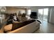 Spacious living room featuring tile floors, and sliding glass doors to a balcony at 2700 Bayshore Blvd # 519, Dunedin, FL 34698