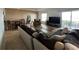 Spacious living room featuring contemporary furniture and a sliding glass door with water views at 2700 Bayshore Blvd # 519, Dunedin, FL 34698