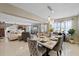 Elegant dining area with a marble-top table, upholstered chairs, and modern pendant lighting at 3309 W Ellicott St, Tampa, FL 33614
